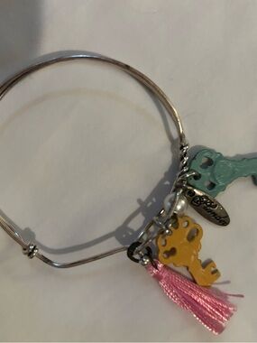 Plunder Silver Bangle Bracelet with Yellow Key, Teal Key & Pink Tassel